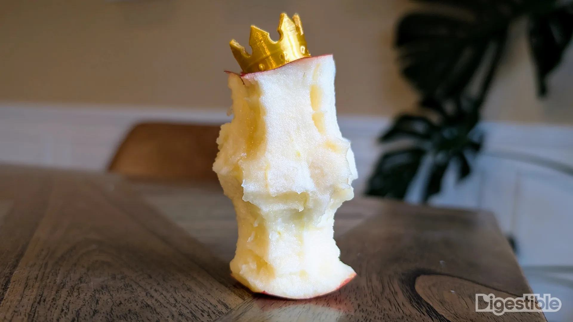 Fully eaten SweeTango Apple wearing a crown.