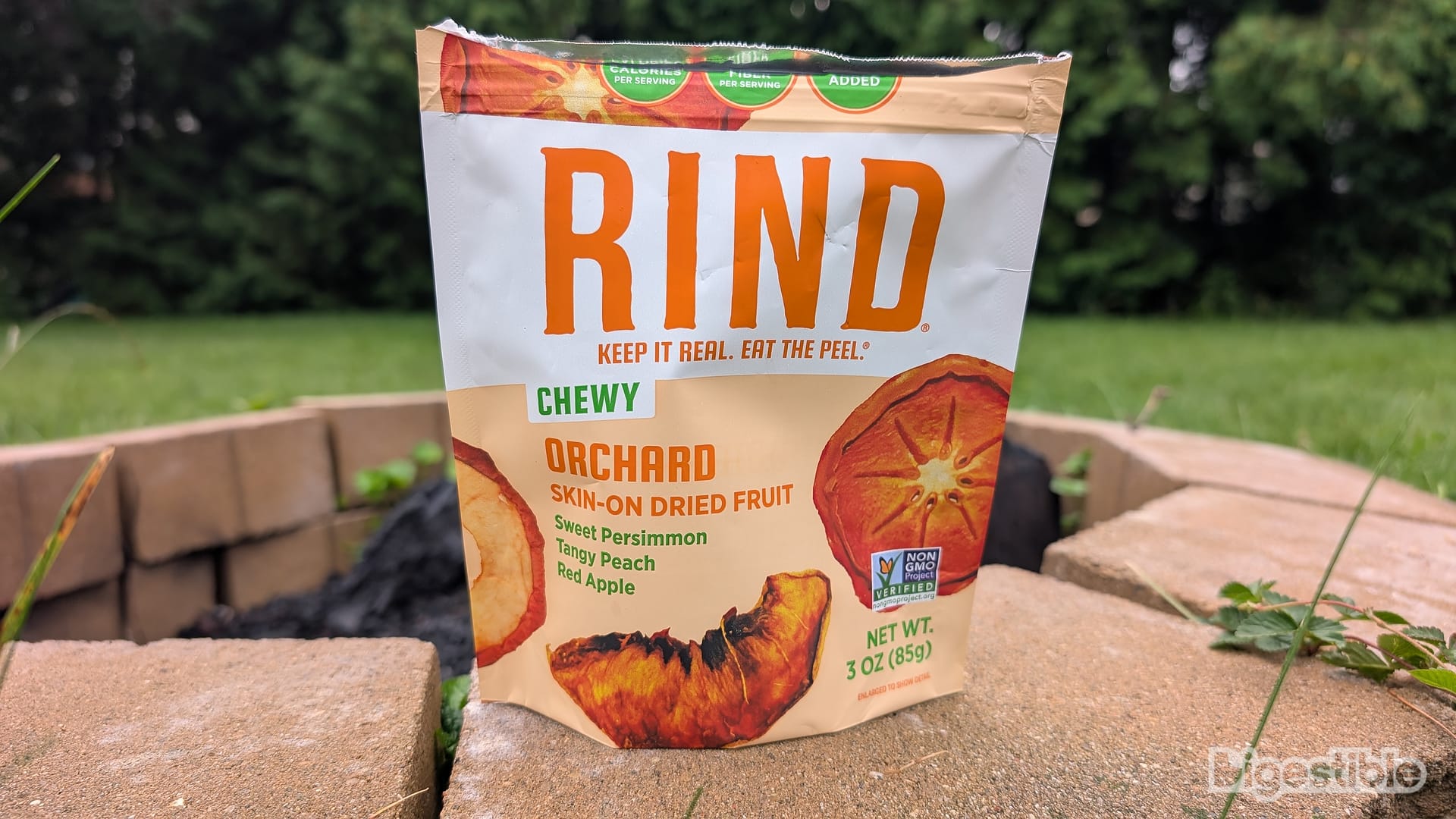 A bag of Orchard RIND Snacks on a fire pit.