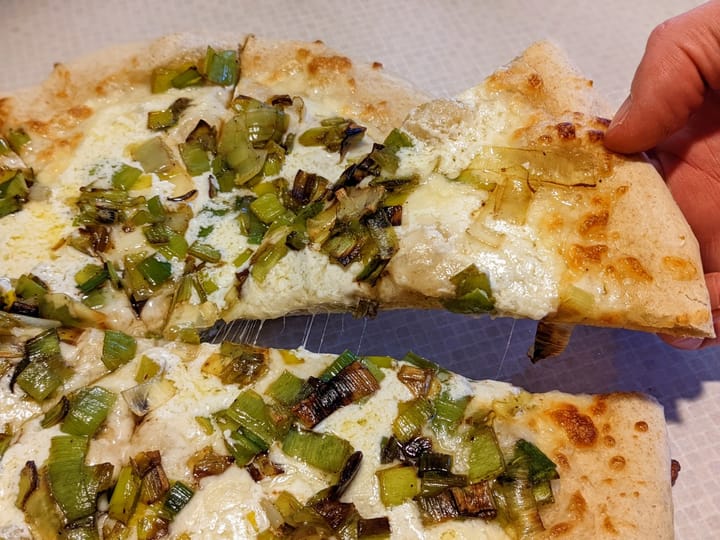 Marscapone and leeks on pizza.